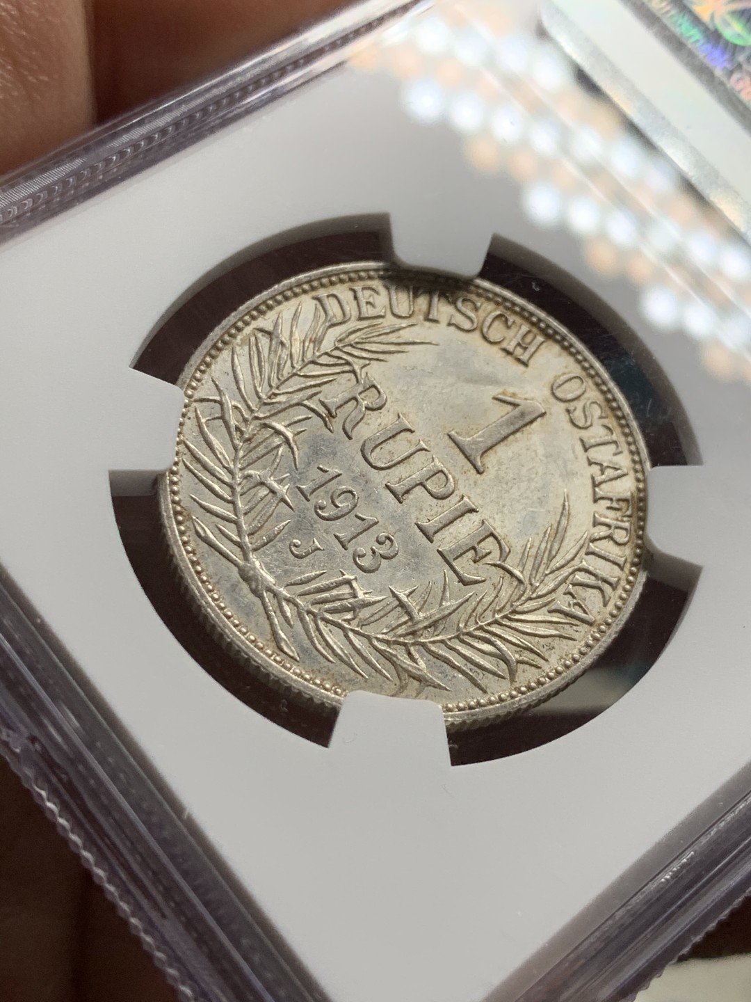 《竞宝斋》第38场-本周一 （全场顺丰包邮） 1913年 NGC UNC德属东非1卢比银币 细节保存的很好 带包浆