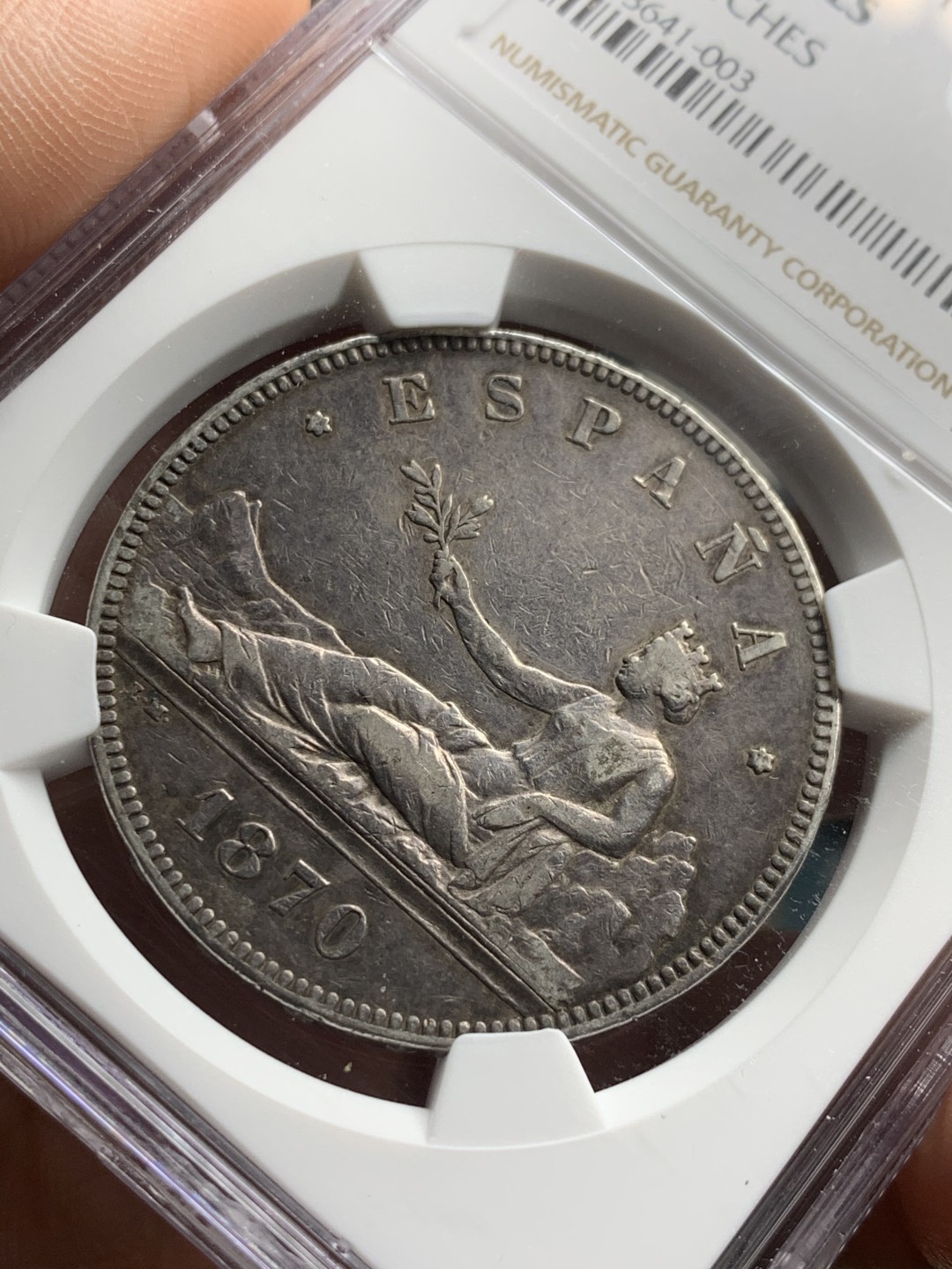 《竞宝斋》第38场-本周一 （全场顺丰包邮） NGC- XFDETAILS 西班牙 1870年 5比塞塔 拿花双柱 大银币 原味黑包浆！