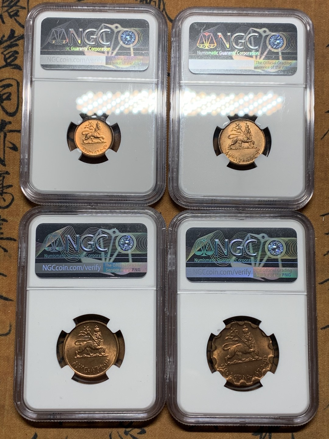 《竞宝斋》第38场-本周一 （全场顺丰包邮） ngc ms64 埃塞俄比亚1936年扛旗狮铜币4枚一套（头像为末代皇帝海尔·塞拉西，经典热门品种）