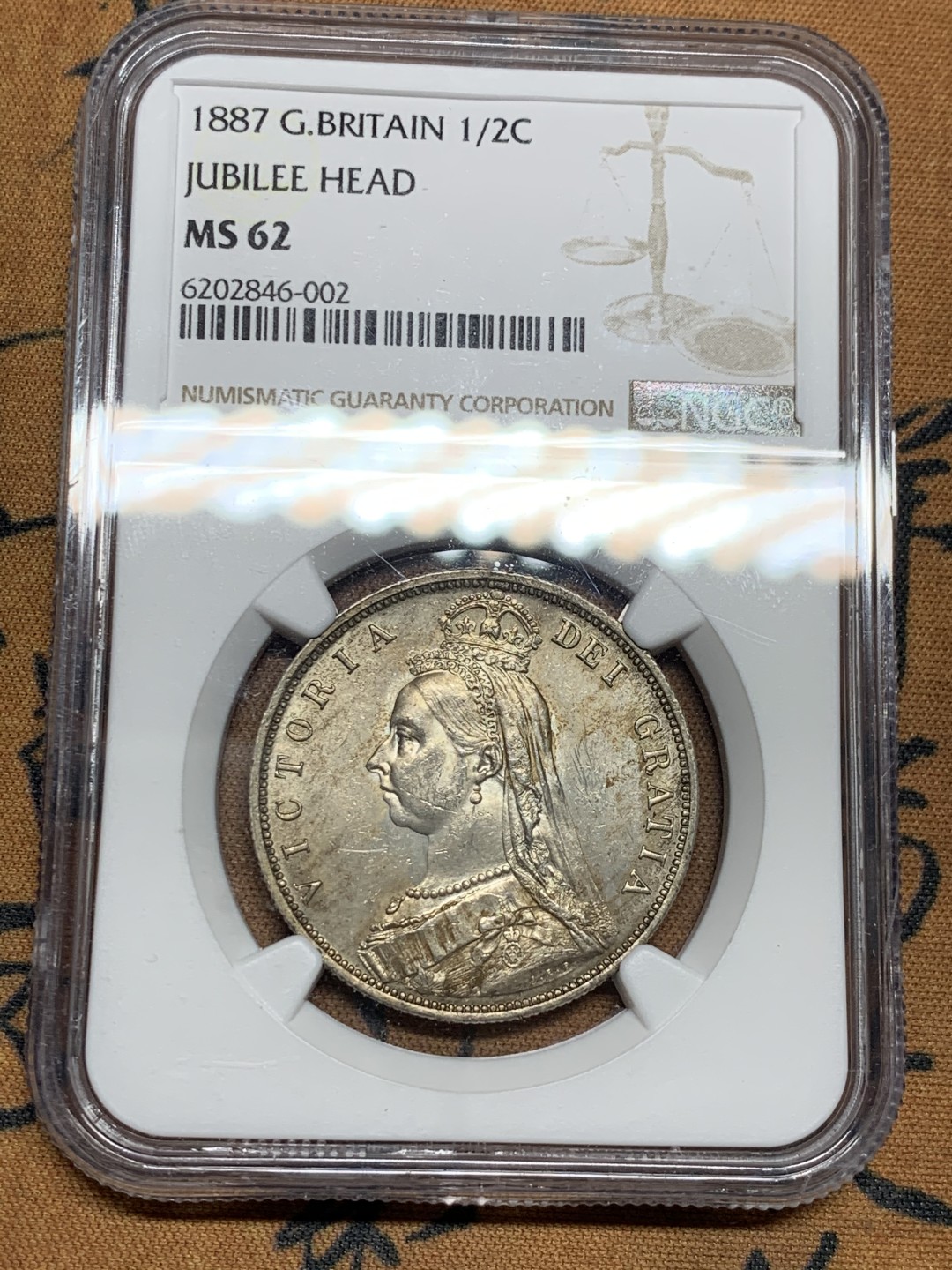 《竞宝斋》第38场-本周一 （全场顺丰包邮） NGC-MS62 英国 1887年1/2克朗高冠银币好品原味深包浆 持续上涨品种 