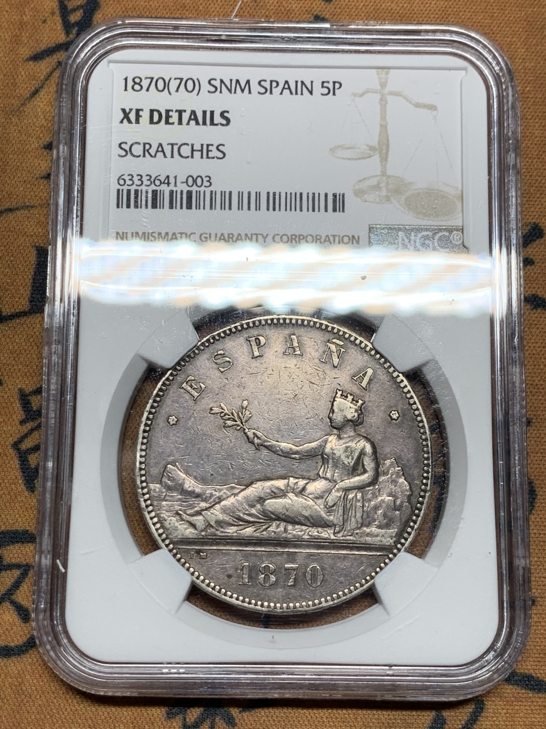 《竞宝斋》第38场-本周一 （全场顺丰包邮） NGC- XFDETAILS 西班牙 1870年 5比塞塔 拿花双柱 大银币 原味黑包浆！