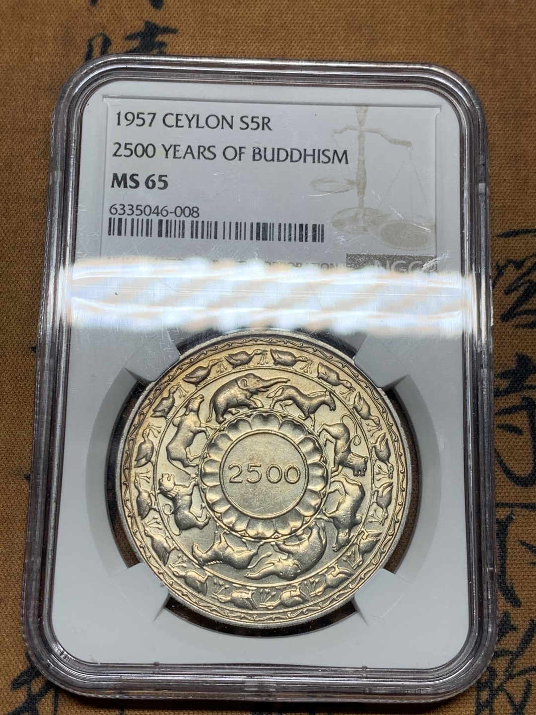 《竞宝斋》第38场-本周一 （全场顺丰包邮） ngc ms65 锡兰1957年纪念佛教2500周年5卢比大银币（热门品种，非白币，包浆漂亮）