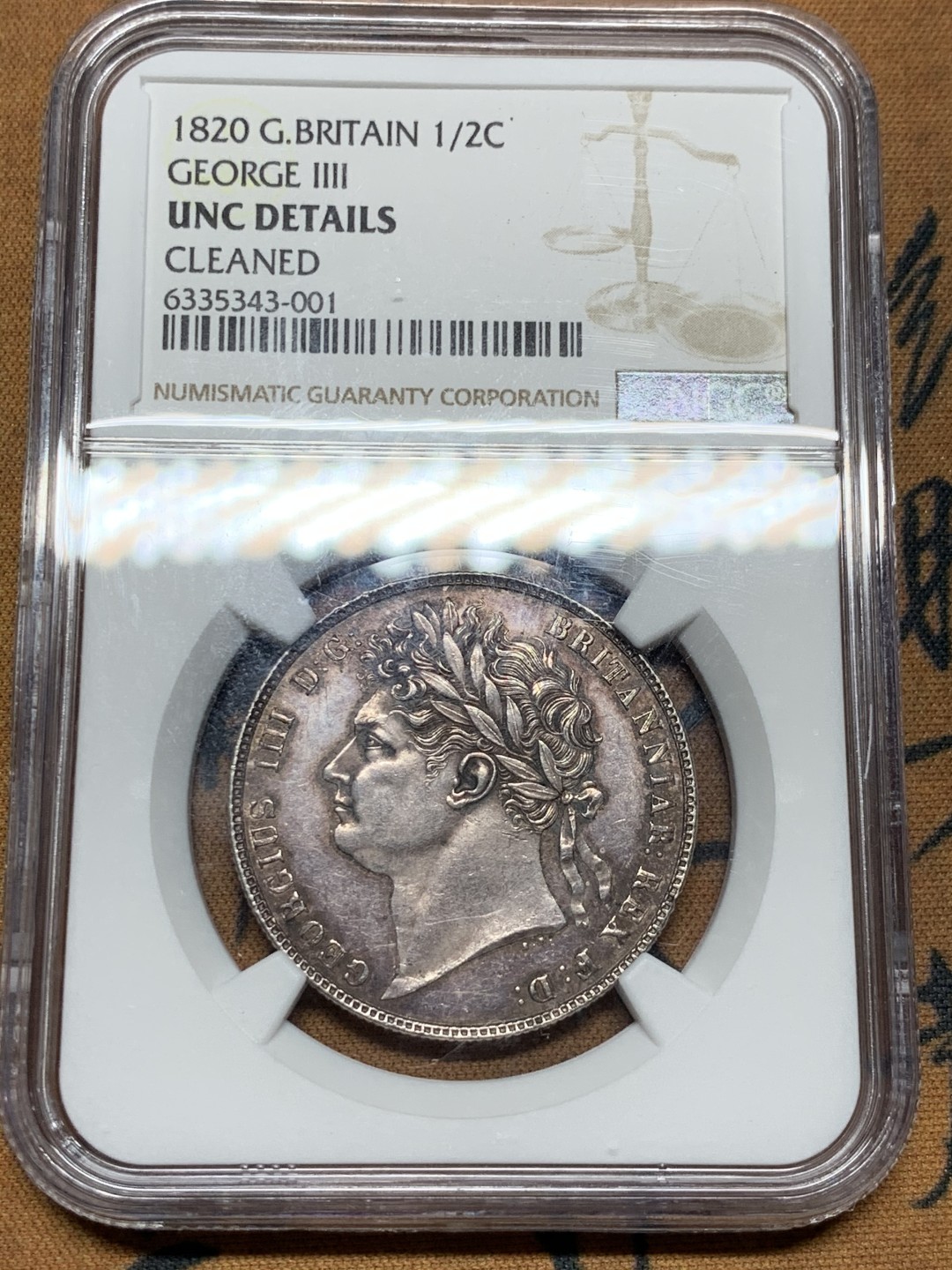 《竞宝斋》第38场-本周一 （全场顺丰包邮） 1820年 NGC UNC英国1820乔治四世半克朗银币，三花版，紫罗兰包浆 不是常见的1821，细节完美