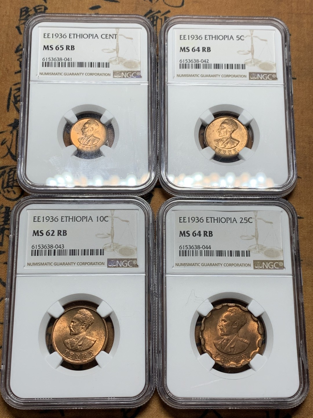 《竞宝斋》第38场-本周一 （全场顺丰包邮） ngc ms64 埃塞俄比亚1936年扛旗狮铜币4枚一套（头像为末代皇帝海尔·塞拉西，经典热门品种）