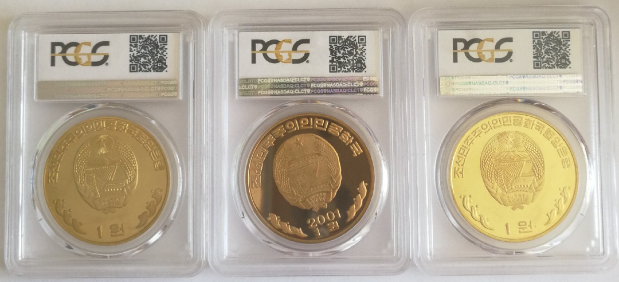 2000朝鲜1元精制铜币金正日与金大中三枚套PCGS