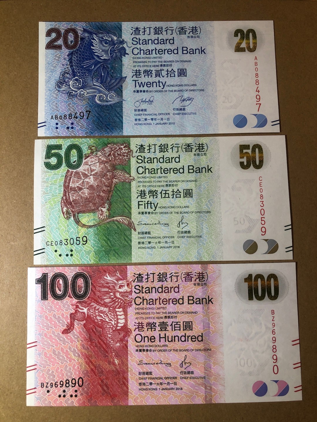 《张总收藏》53期——外币精品汇(拍品增加中) 香港20、50、100元三张 UNC 渣打银行