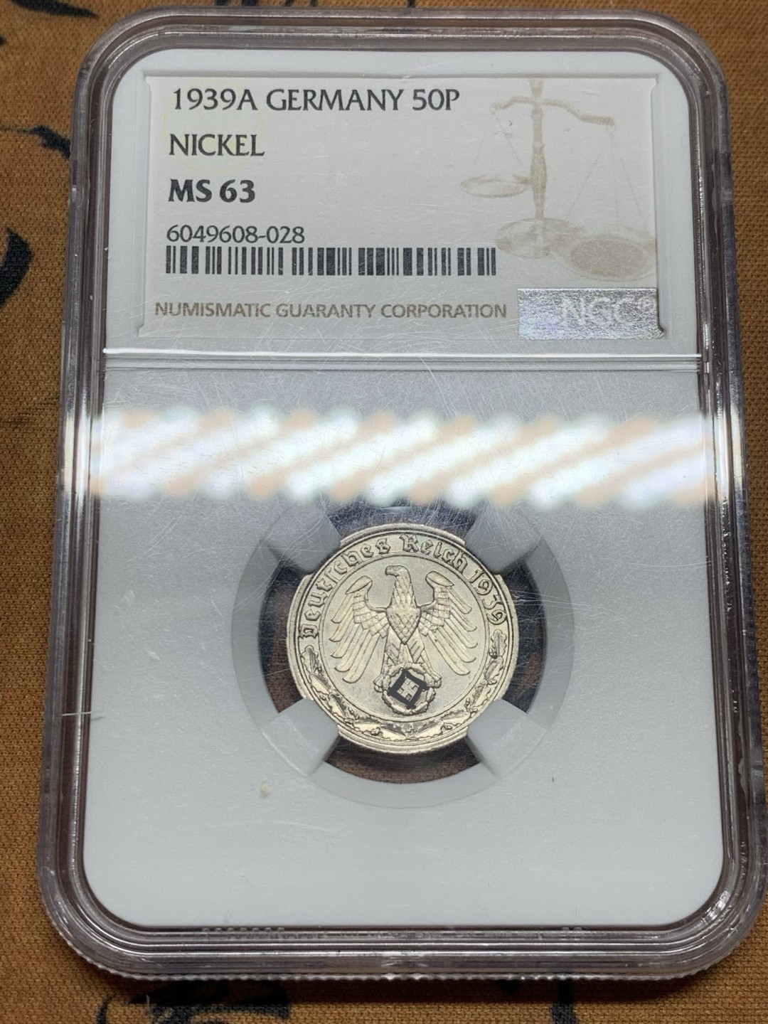 《竞宝斋》第44场-本周日，周一2场连拍（全场顺丰包邮） NGC MS63 德三 1939A 50芬尼 镍币 因为回炉造武器存世稀少 固也叫坦克币 此币存世少高分更是寥寥无几！ 63分可以算是季军分数了！