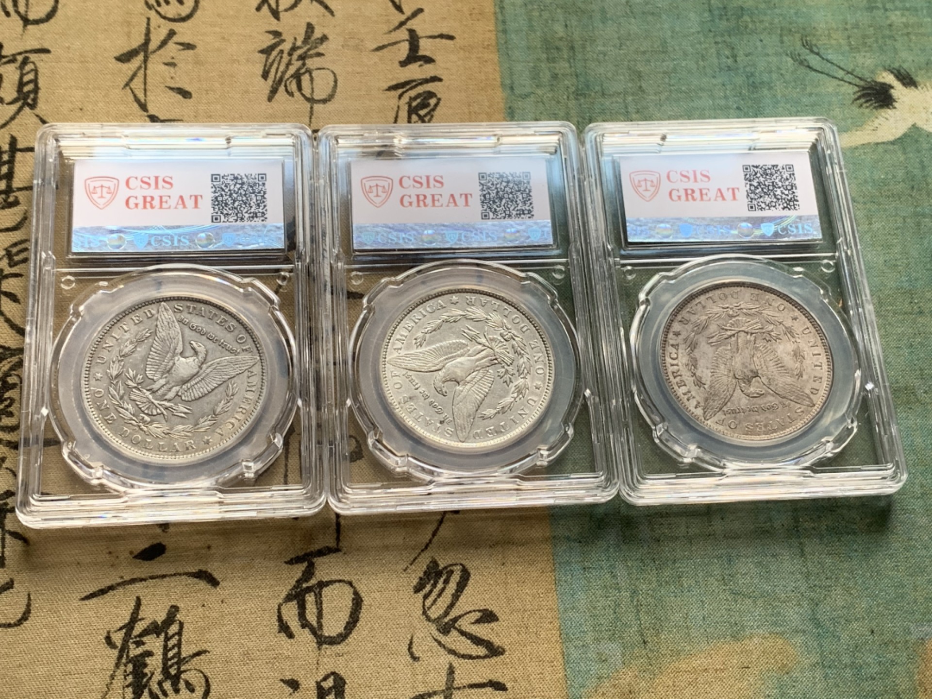 《竞宝斋》第44场-本周日，周一2场连拍（全场顺丰包邮） 摩根银币3枚一组【】美国1896 1891 1889年