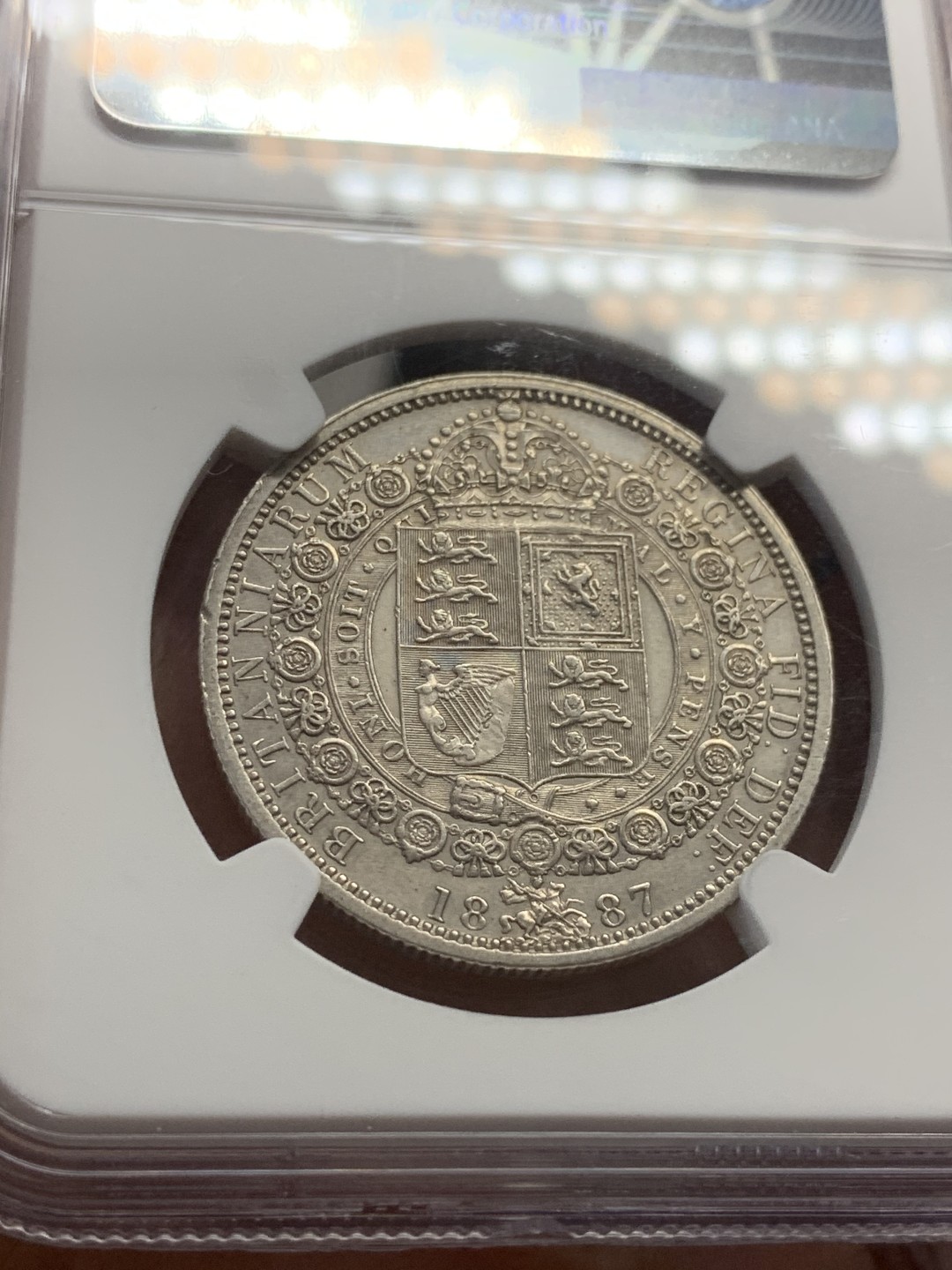 《竞宝斋》第44场-本周日，周一2场连拍（全场顺丰包邮） NGC严评 AUD1887英国维多利亚高冠半克朗1/2克朗银币，1887年为维多利亚高冠克朗首年，英系入门好品种，状态不错，细节好