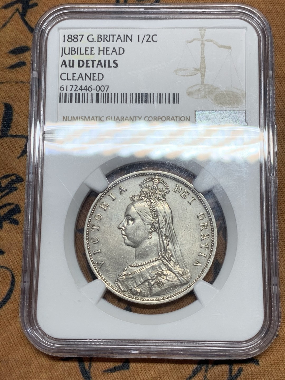 《竞宝斋》第44场-本周日，周一2场连拍（全场顺丰包邮） NGC严评 AUD1887英国维多利亚高冠半克朗1/2克朗银币，1887年为维多利亚高冠克朗首年，英系入门好品种，状态不错，细节好
