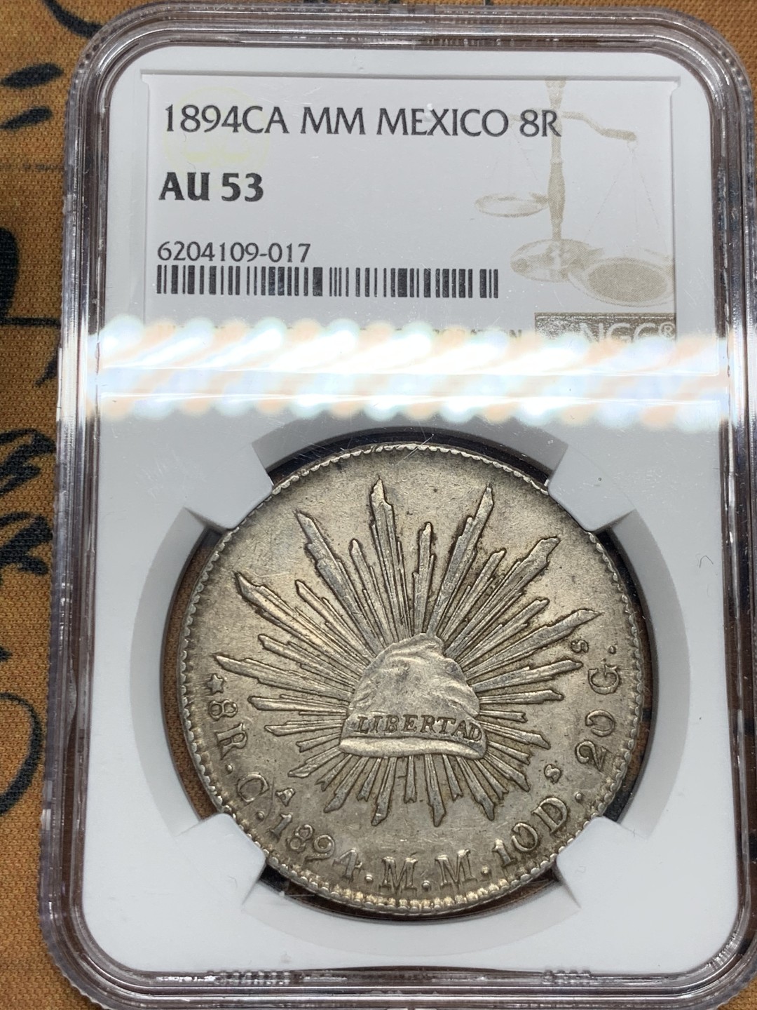 《竞宝斋》第47场-本周日，周一2场连拍（全场不限金额包邮） NGC AU53 墨西哥 1894年 CA版 花边鹰洋 原味深彩 值得收藏