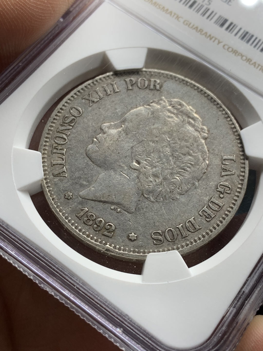 《竞宝斋》第47场-本周日，周一2场连拍（全场不限金额包邮） NGC AU评级 西班牙 1892年 阿方索十三世 爆炸头 5比塞塔 双柱银币 状态不错