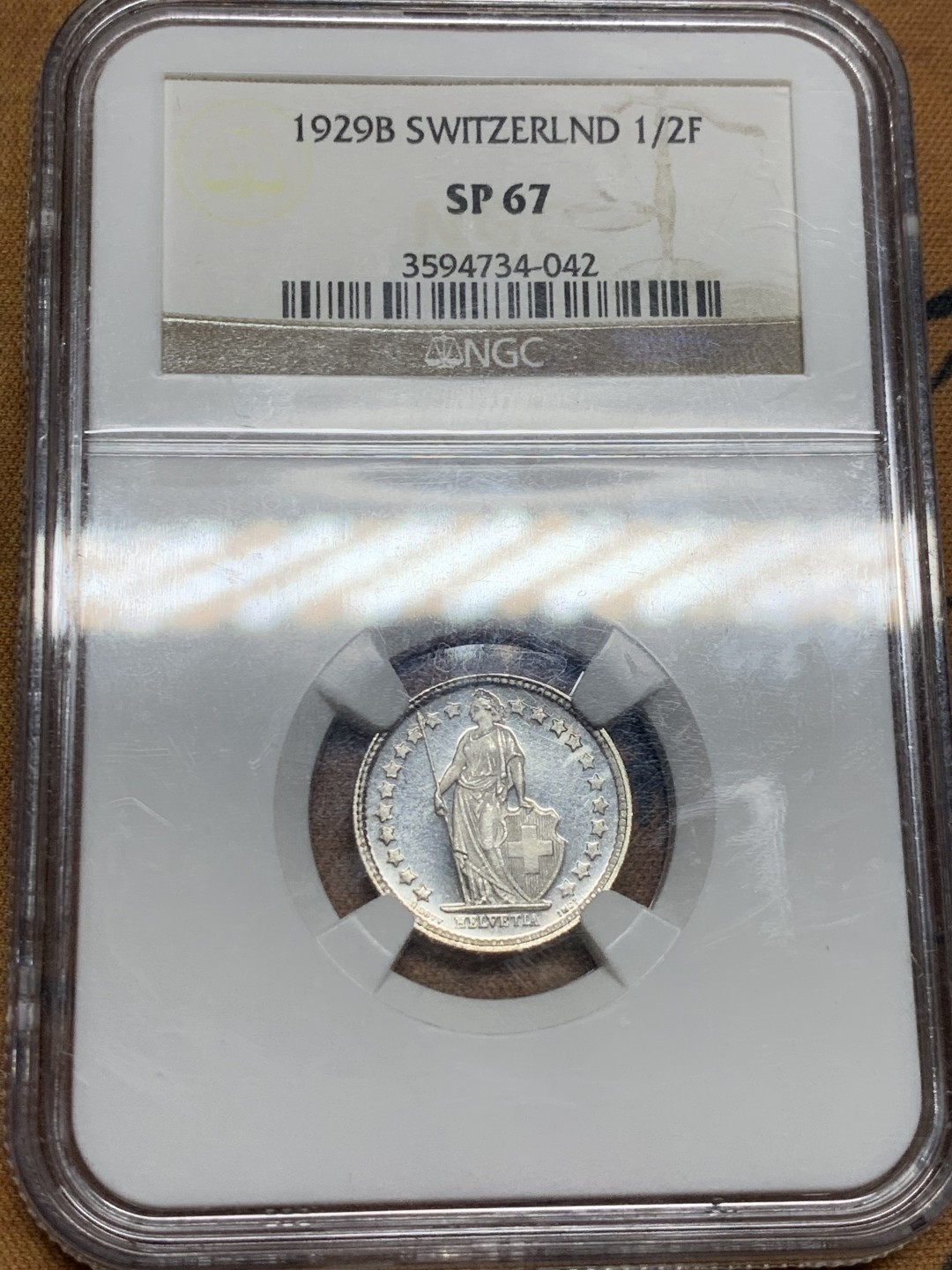 《竞宝斋》第49场-本周日，周一2场连拍（全场不限金额包邮） NGC SP67 冠军分 瑞士 1929年 1/2法郎精制银币B版 早期深打、完整全镜面 N对于这种深打完整全镜面状态的 很小概率给SP 非常少见
