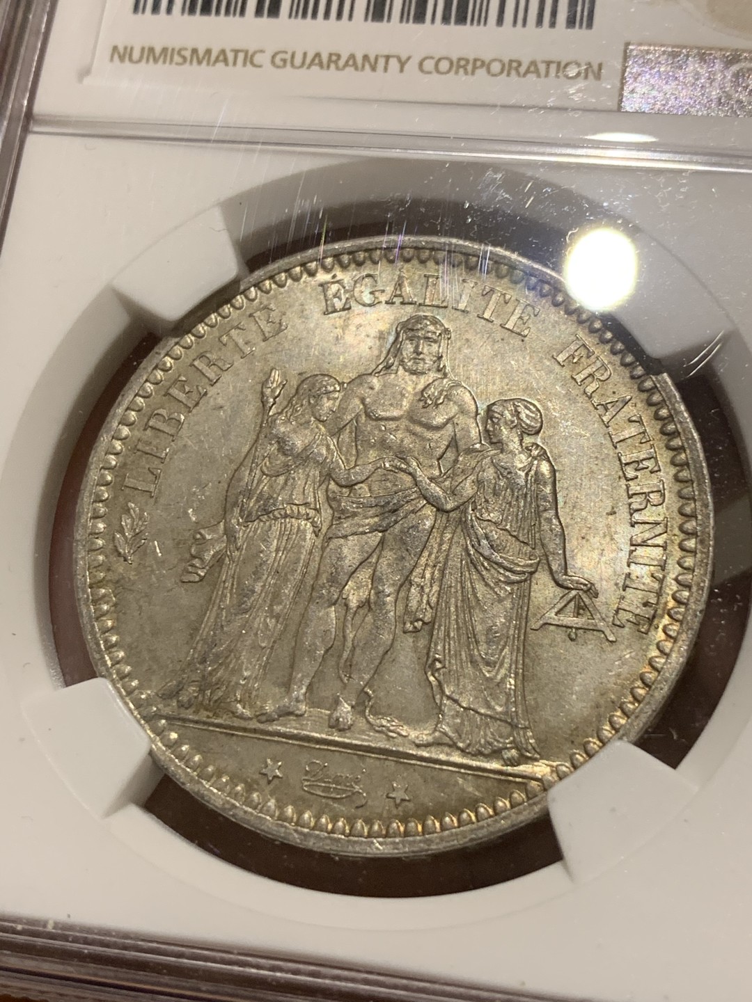 《竞宝斋》第50场-本周日，周一2场连拍（全场不限金额包邮） NGC MS62 法国 1873年 大力神 5法郎 银币 五彩包浆 非常的漂亮