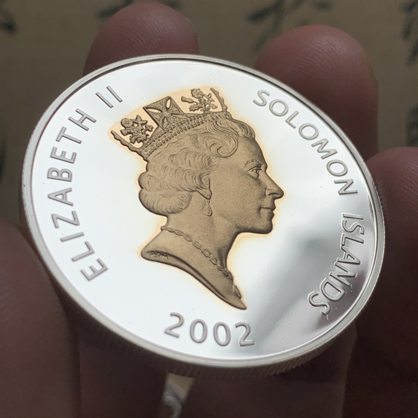 《竞宝斋》第52场-本周日，周一2场连拍（全场不限金额包邮） PF级 所罗门群岛2002克朗型5元镀金银币 议会开幕典礼 完美品相 