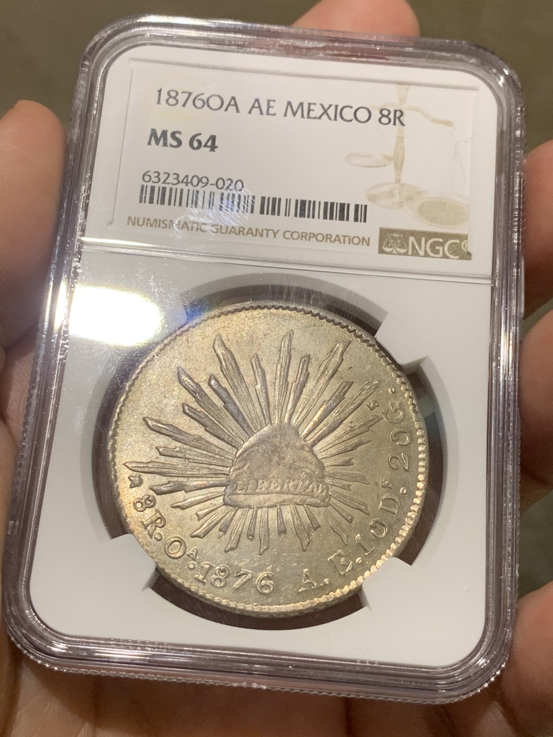 《竞宝斋》第54场-本周日，周一2场连拍（全场不限金额包邮） NGC MS64 稀少OA版 淡彩车轮光  墨西哥1876 鹰洋 银币 难得高分 OA裸币都是作为XF-AU的存在 这枚64分，毕业品种