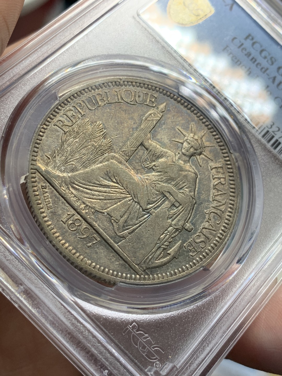 《竞宝斋》第55场-本周日，周一2场连拍（全场不限金额包邮） PCGS AUD 1897 法属印度支那1皮 银币 深彩包浆，难得状态