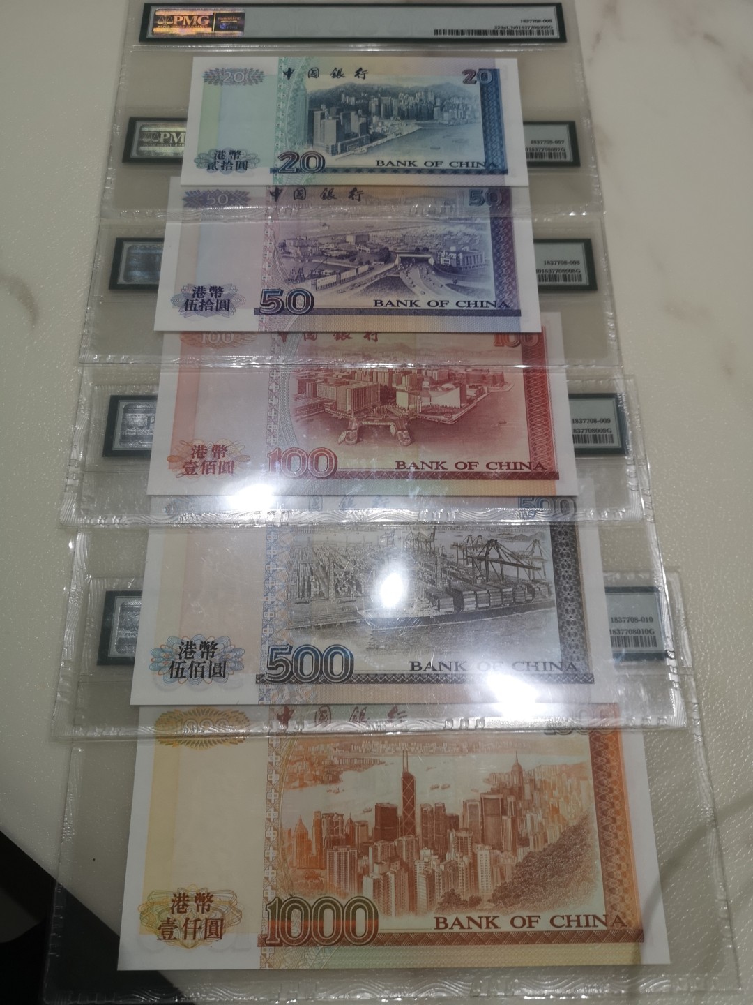 《外钞收藏家》第一百八十期拍卖 1994年中国银行五张一套 全同号 靓号 PMG封装 带精装大册子