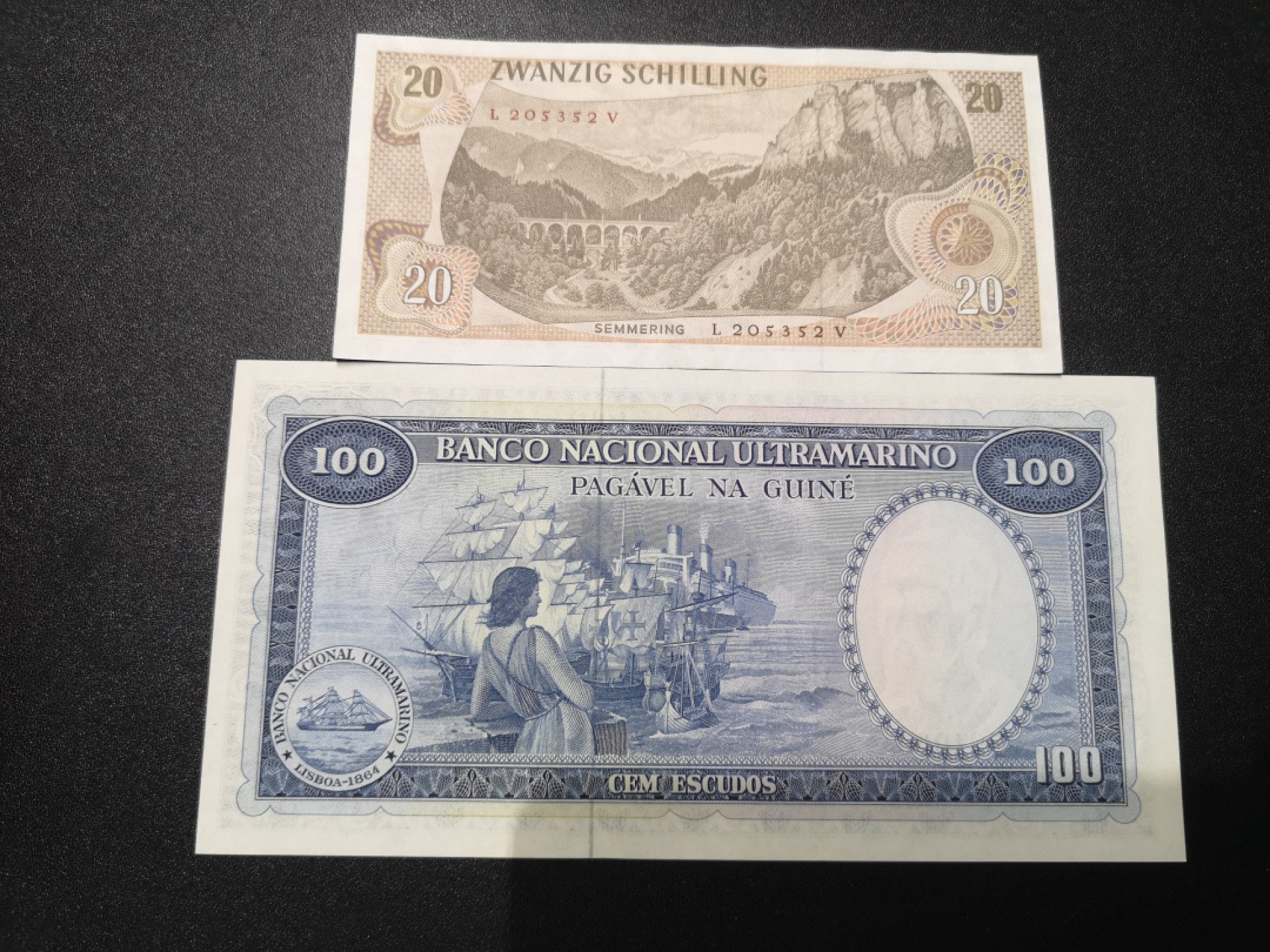《外钞收藏家》第一百七十九期拍卖 奥地利20先令和葡属几内亚100 两张一起 全新 奥地利有轻微压痕