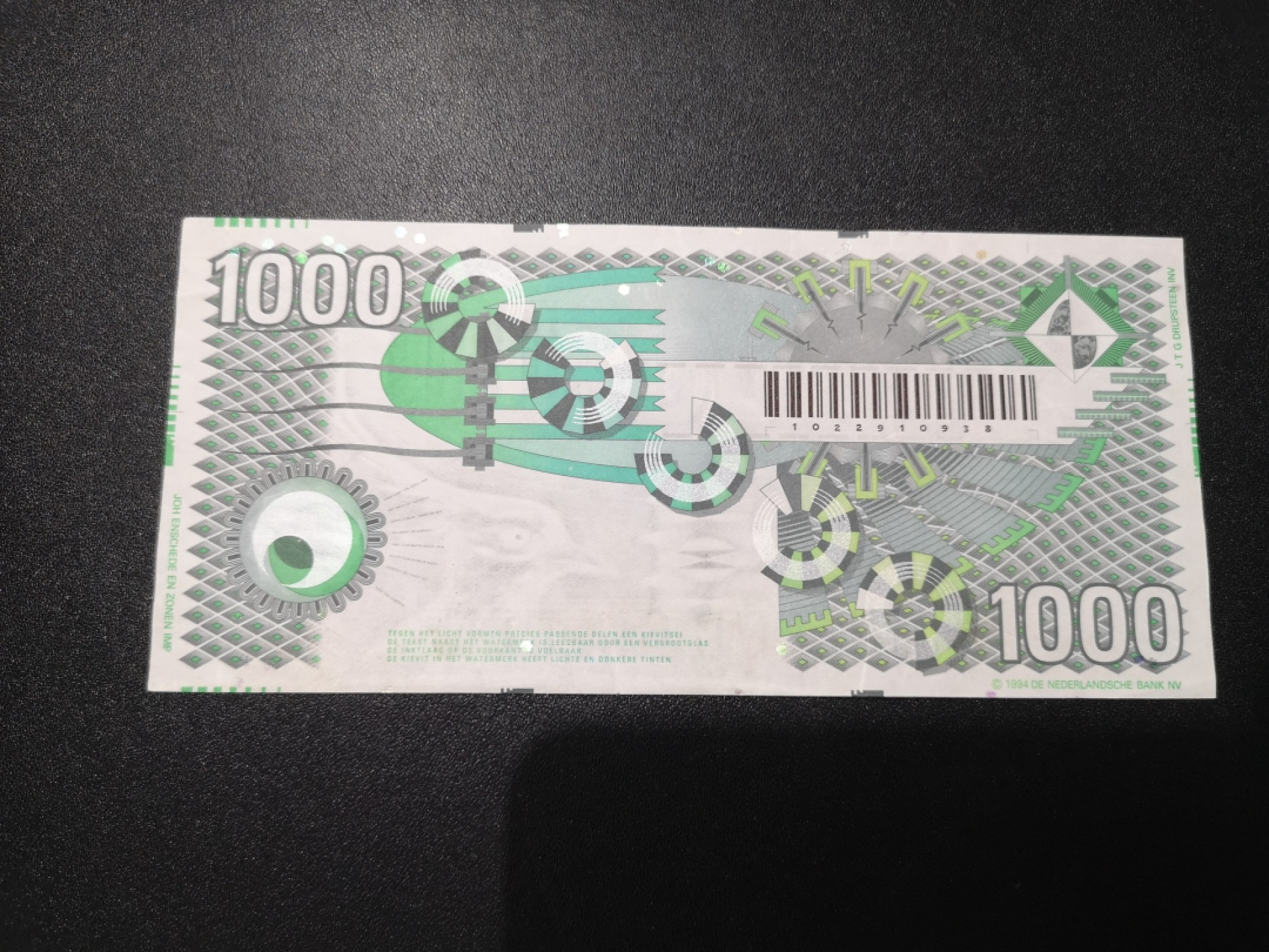 《外钞收藏家》第一百七十九期拍卖 荷兰齿轮版1000盾 也定义为AU品相吧 有一点点受潮 参考测光等