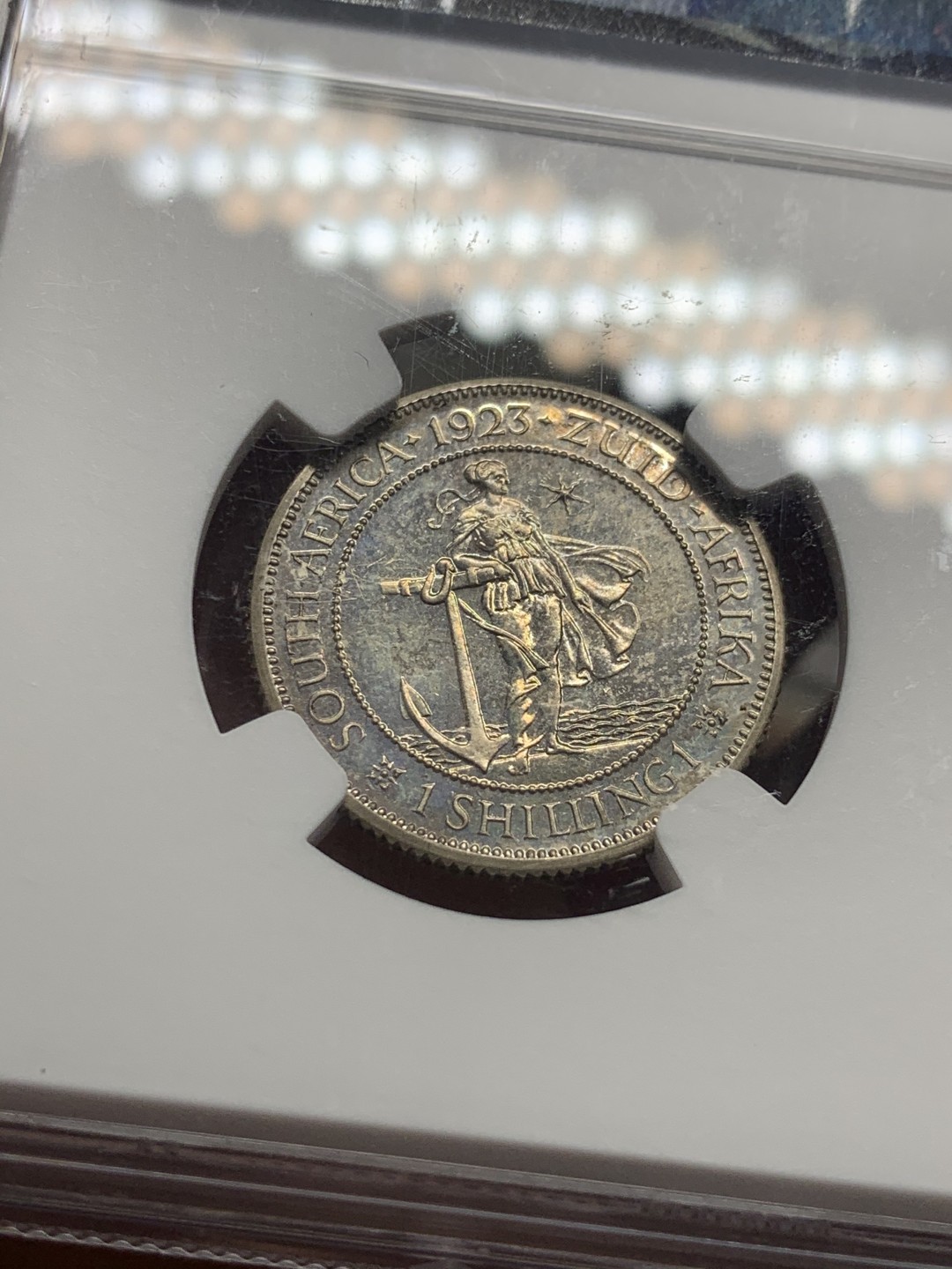 《竞宝斋》第63场-本周日 （全场不限金额包邮） NGC PF63 英属南非 1923年 乔治五世 1先令精制银币 镜面底板带彩包浆