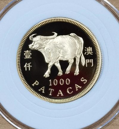 北京马甸外国钱币专卖微拍第七十八期，外国金银币专场，陆续上新，欢迎光临 - 1997年澳门生肖牛金币重15.976克成色917，品相如图，有丝划