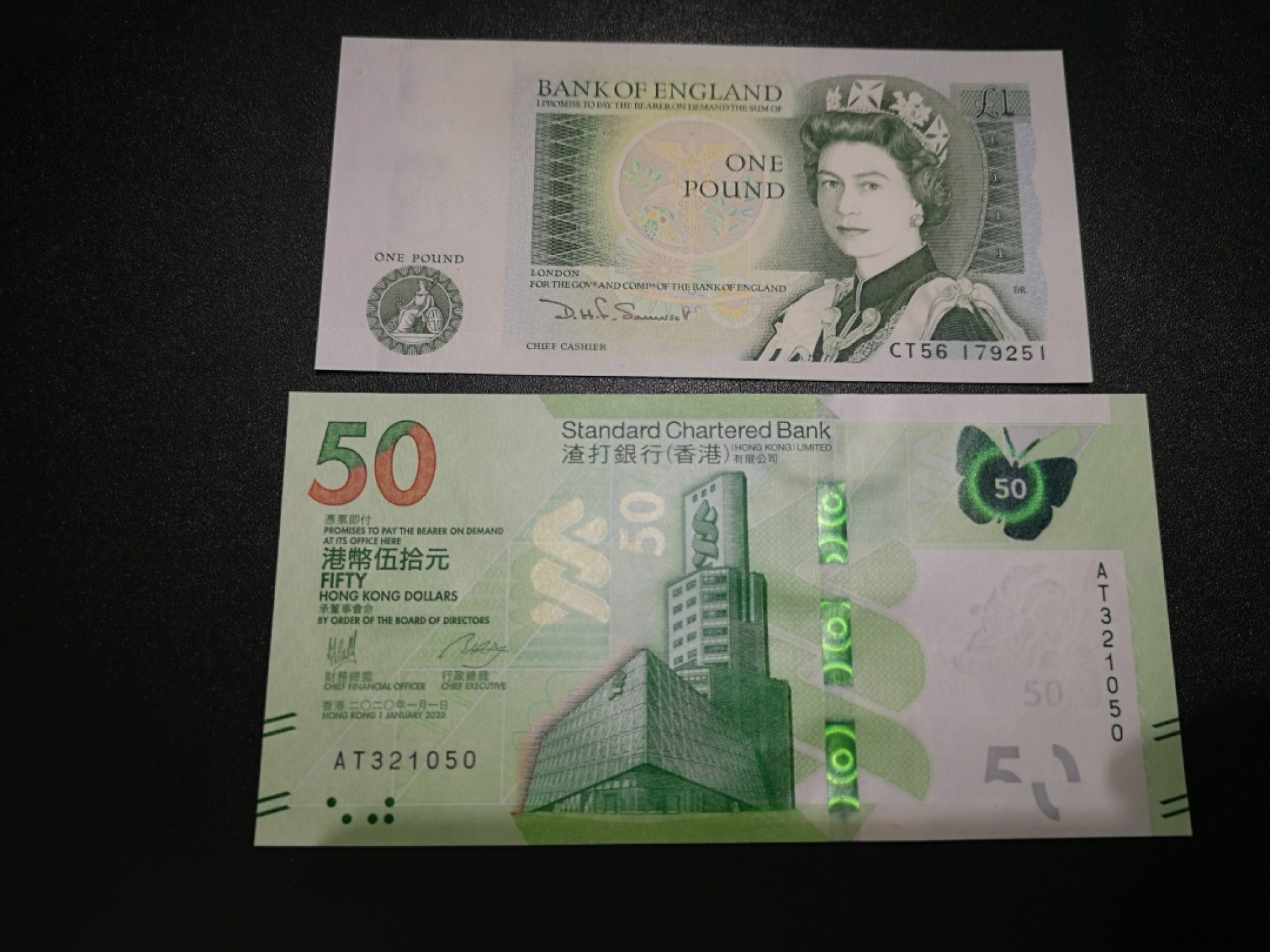 《外钞收藏家》第一百八十二期拍卖 英国D序列1镑加2020年渣打银行港币50元 全新UNC