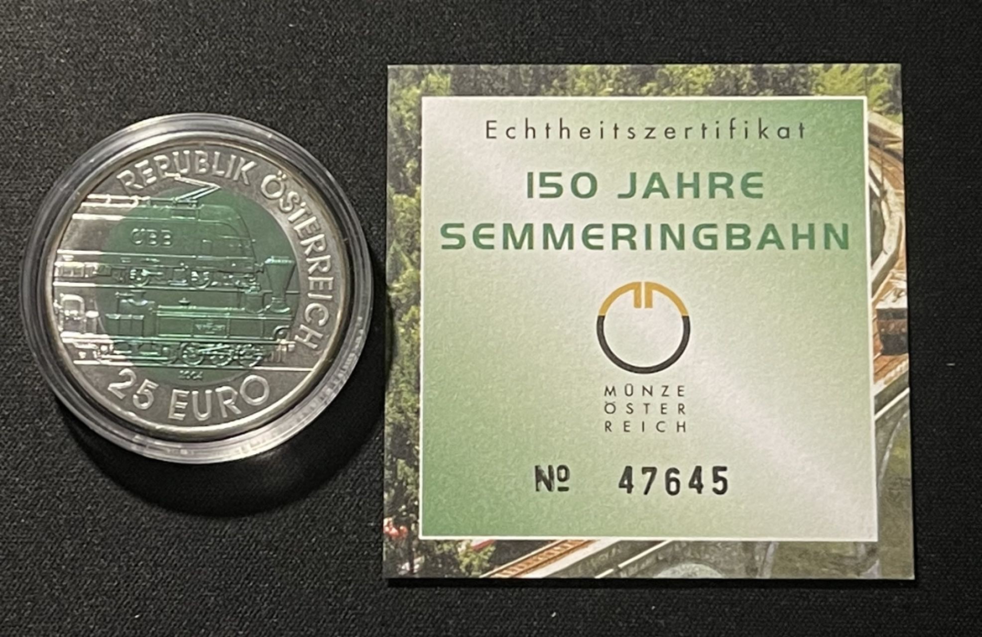 紫瑗钱币——第196期拍卖 奥地利 2004年 森梅林格铁路 150周年 25欧元 银铌纪念币  原盒证书