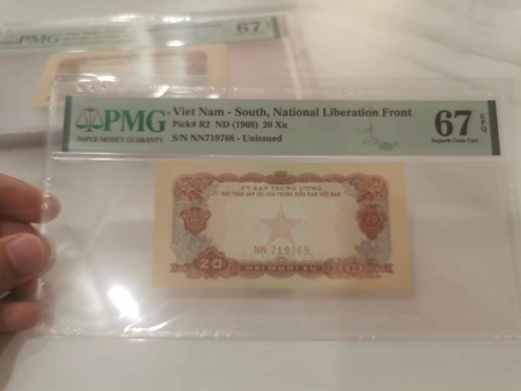 13.【鲸贝乐淘★道德经】“万物作而弗始，生而弗有，为而弗恃，功成而不居”号拍卖 【中国代印★越南🇻🇳】编号NN719768，1968年20Xu，未发行，PMG67E