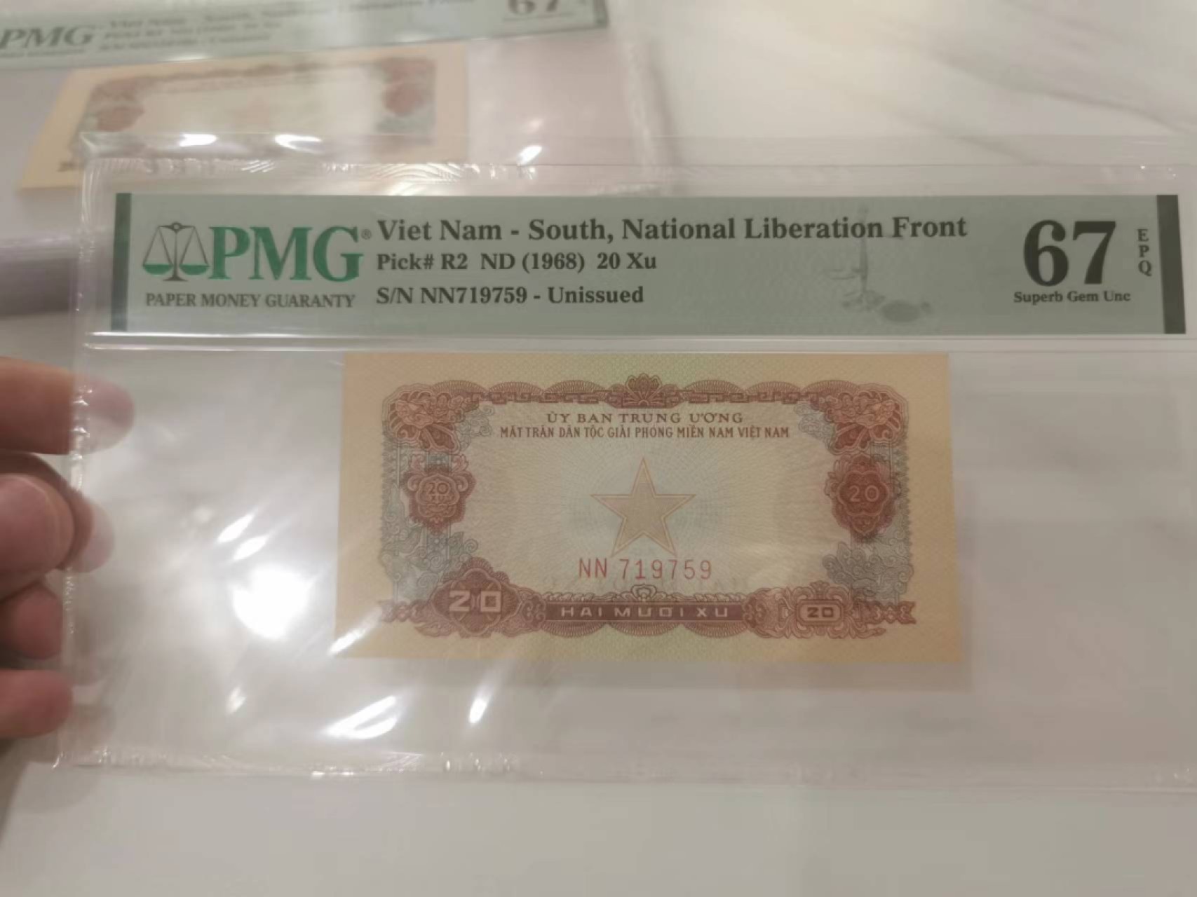 13.【鲸贝乐淘★道德经】“万物作而弗始，生而弗有，为而弗恃，功成而不居”号拍卖 【中国代印★越南🇻🇳】编号NN719759，1968年20Xu，未发行，PMG67E