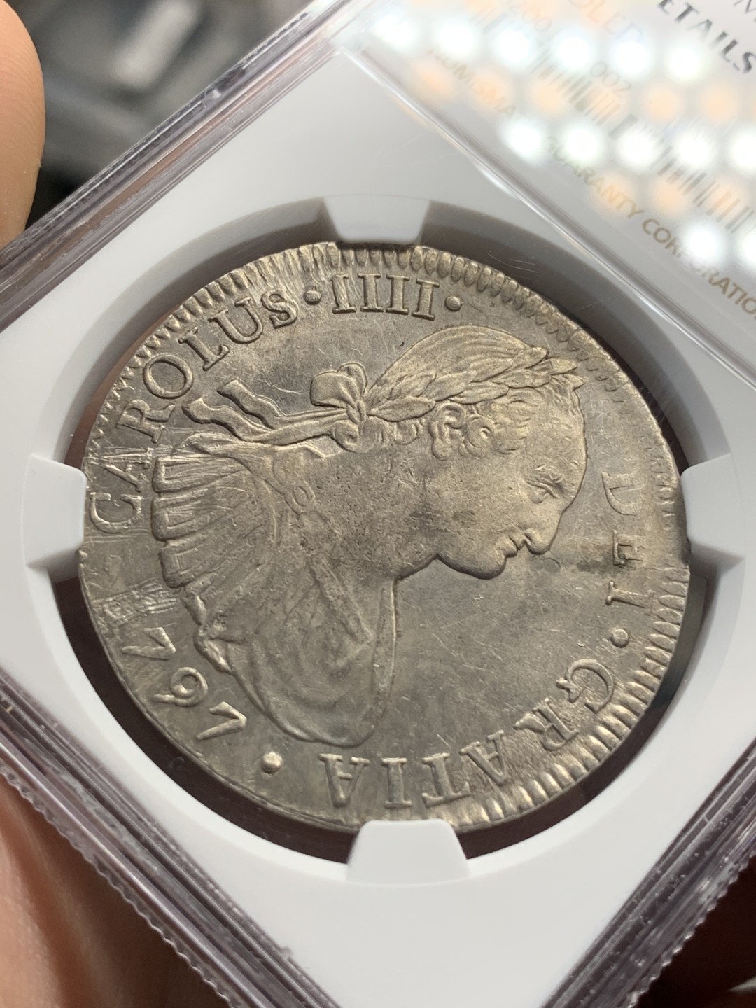 《竞宝斋》第67场-本周日，周一，周四.3场连拍（全场不限金额包邮） NGC UNC细节评级 墨西哥 1797年 卡四双柱 8R银币 打制的很不错 细节见图