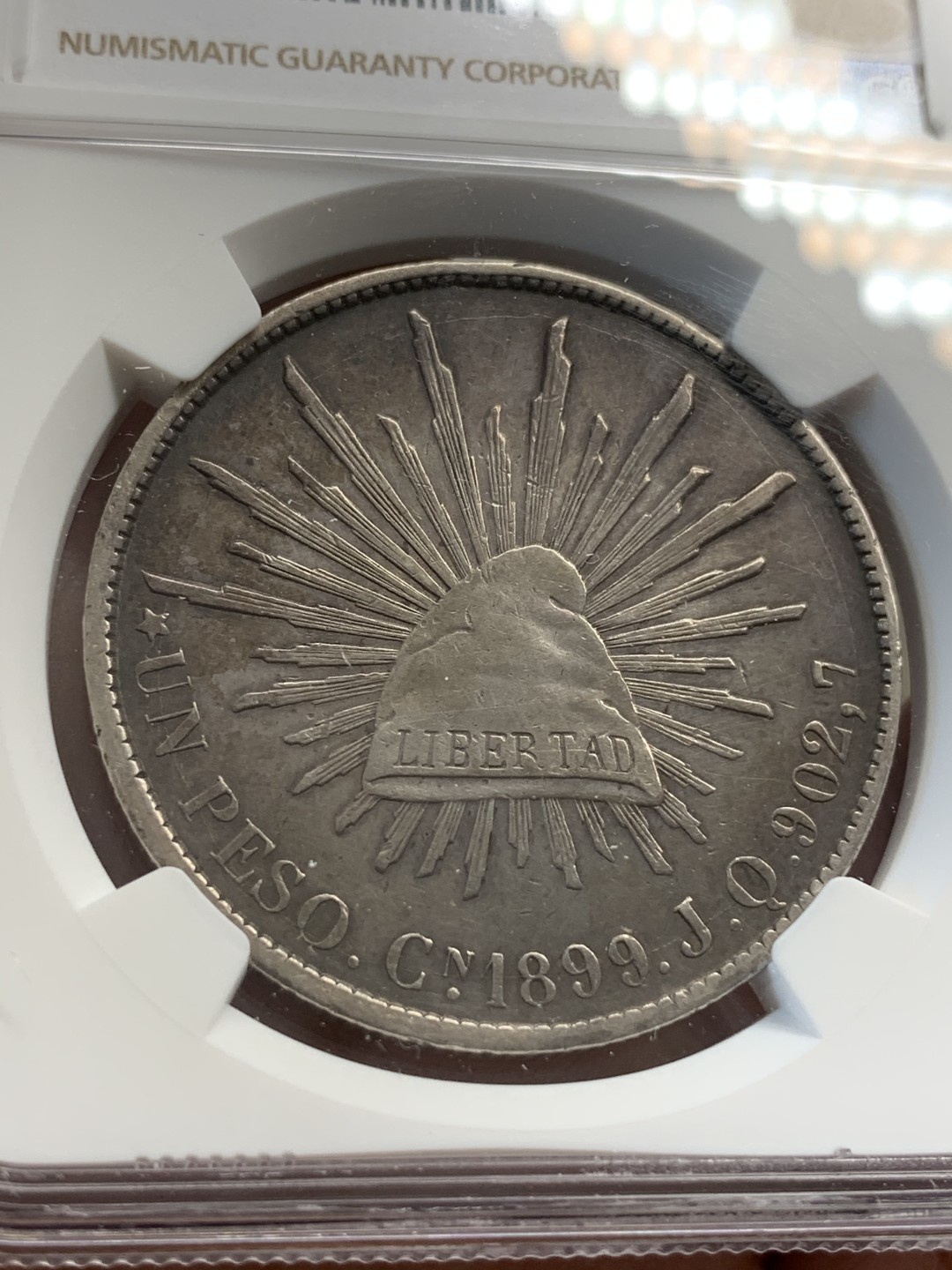 《竞宝斋》第67场-本周日，周一，周四.3场连拍（全场不限金额包邮） NGC AU细节评级 墨西哥 1899年 CN JQ 直边鹰洋 银币 状态不错 慢慢岁月的痕迹