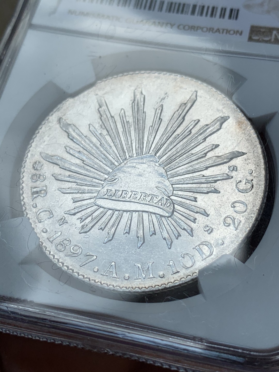 《竞宝斋》第67场-本周日，周一，周四.3场连拍（全场不限金额包邮） NGC MS61 墨西哥 1897年 8R 花边鹰洋 底板深打 状态好，羽毛光亮 一根不少