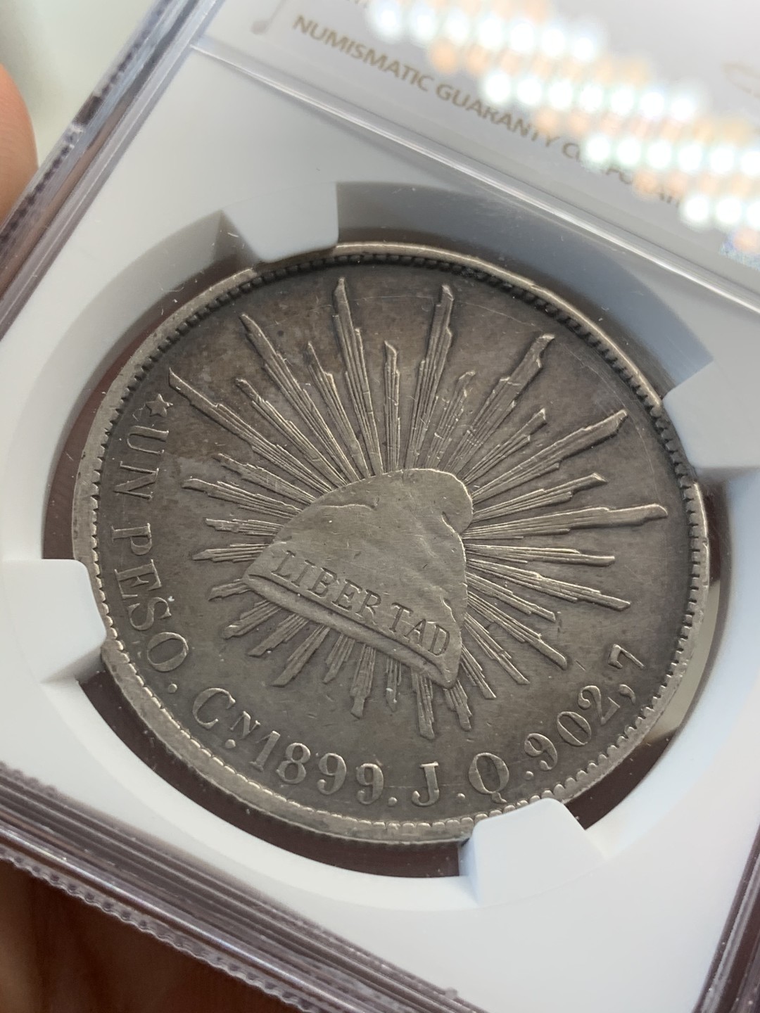 《竞宝斋》第67场-本周日，周一，周四.3场连拍（全场不限金额包邮） NGC AU细节评级 墨西哥 1899年 CN JQ 直边鹰洋 银币 状态不错 慢慢岁月的痕迹