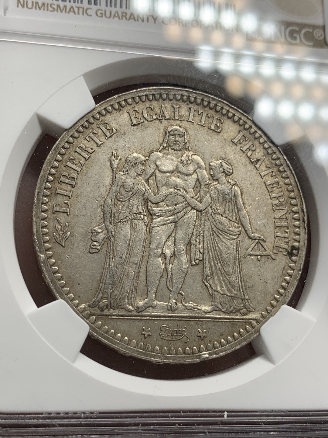 《竞宝斋》第68场-本周日，周一，周四.3场连拍（全场不限金额包邮） NCG AU55 法国 1873年大力神五法郎银币 好品相带转光