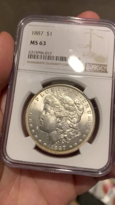 《竞宝斋》第68场-本周日，周一，周四.3场连拍（全场不限金额包邮） NGC-MS63美国1887年摩根银币 卷首币鹰面满五彩