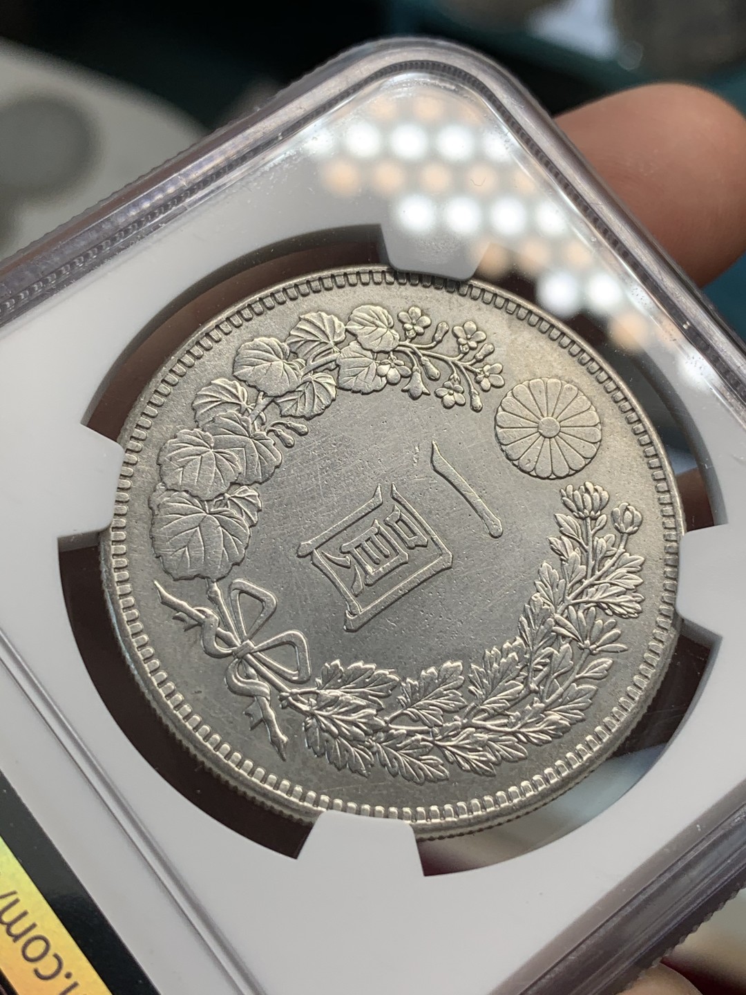 《竞宝斋》第69场-本周日，周一，周四.3场连拍（全场不限金额包邮） NGC AU 日本 明治三十五年 日龙 壹元 银币 淡彩包浆 正面特别好