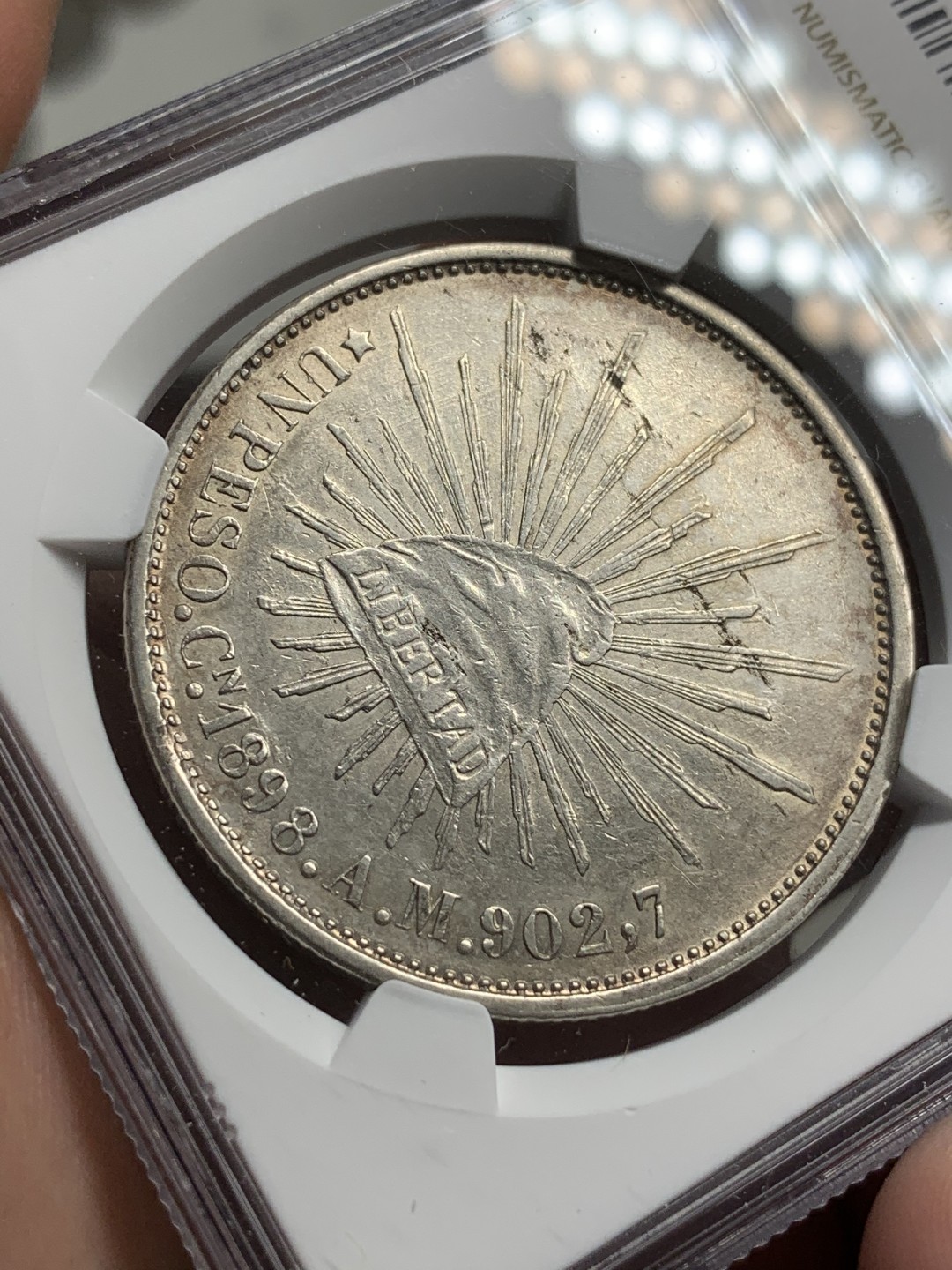 《竞宝斋》西.葡及其殖民地国家专场-第70场（全场不限金额包邮） NGC AUD 墨西哥 1898年CN AM版 直边 鹰洋银币淡彩包浆 细节优秀