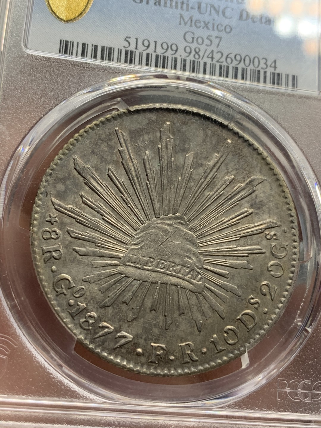 《竞宝斋》第76场-本周日，周一2场连拍（全场不限金额包邮） PCGS UNC鹰洋1877年GO FR 未流通 五彩包浆氧化极其到位、强转光，状态极其到位，非常可惜，幸运帽有上有划痕。