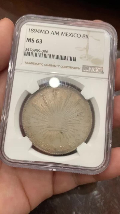 《竞宝斋》第76场-本周日，周一2场连拍（全场不限金额包邮） NGC MS63墨西哥1894年花边鹰洋8R银币 味道币一枚 底光 包浆 皆有