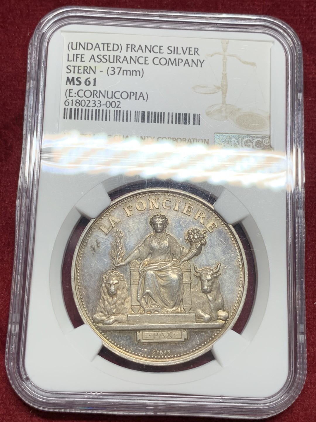 《竞宝斋》第77场-本周日，周一，周四3场拍卖（全场不限金额包邮） NGC MS61法国保险公司女神银章直径:37mm重量:22.68g 边铭:丰饶角+银标章面有点镜面效果，女神细节漂亮