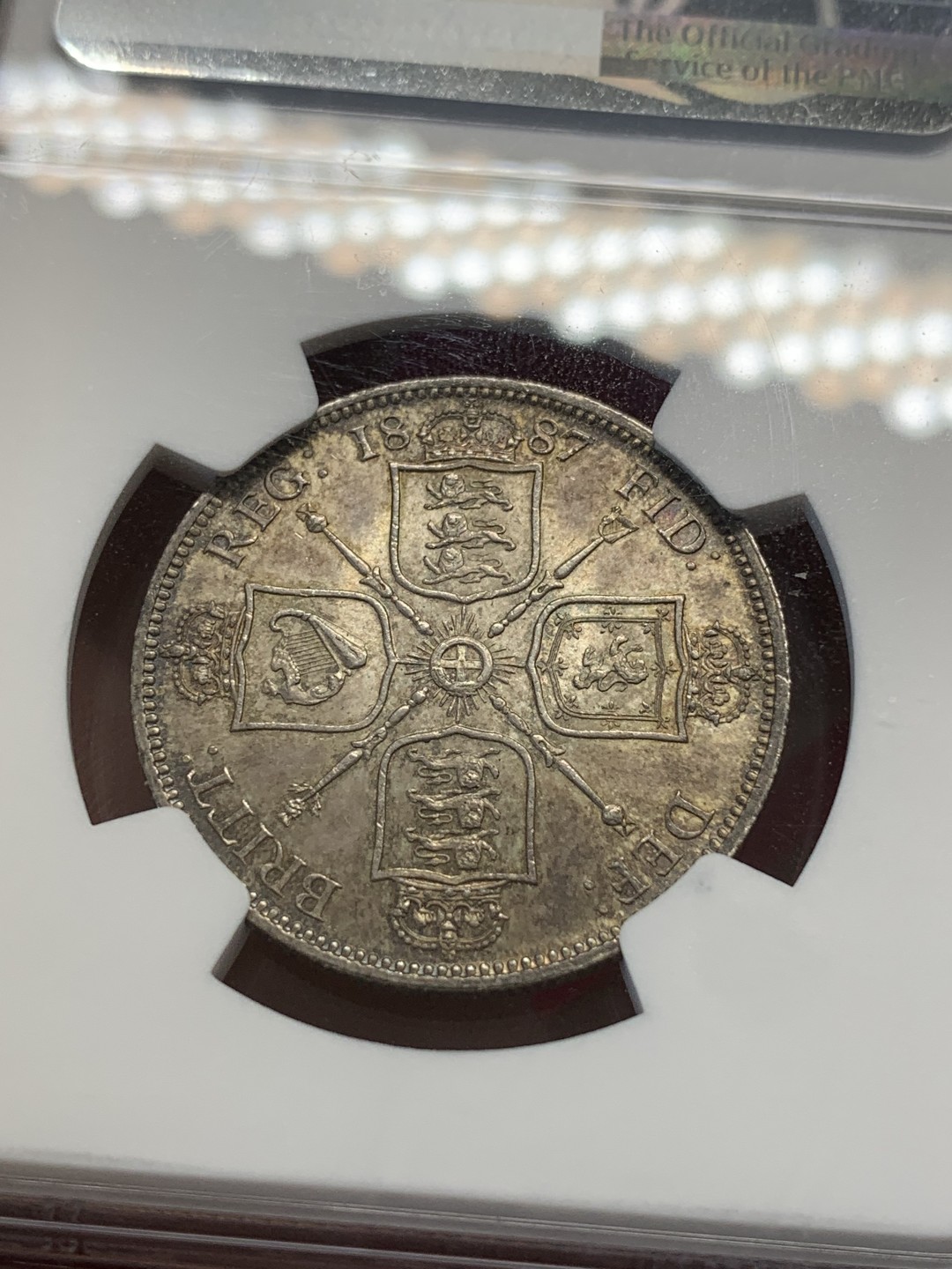 《竞宝斋》第80场-本周日，周一 2场连拍（全场不限金额包邮） NGC-MS62 英国1887年 维多利亚高冠佛洛林银币  双面重彩 很好的一枚银币