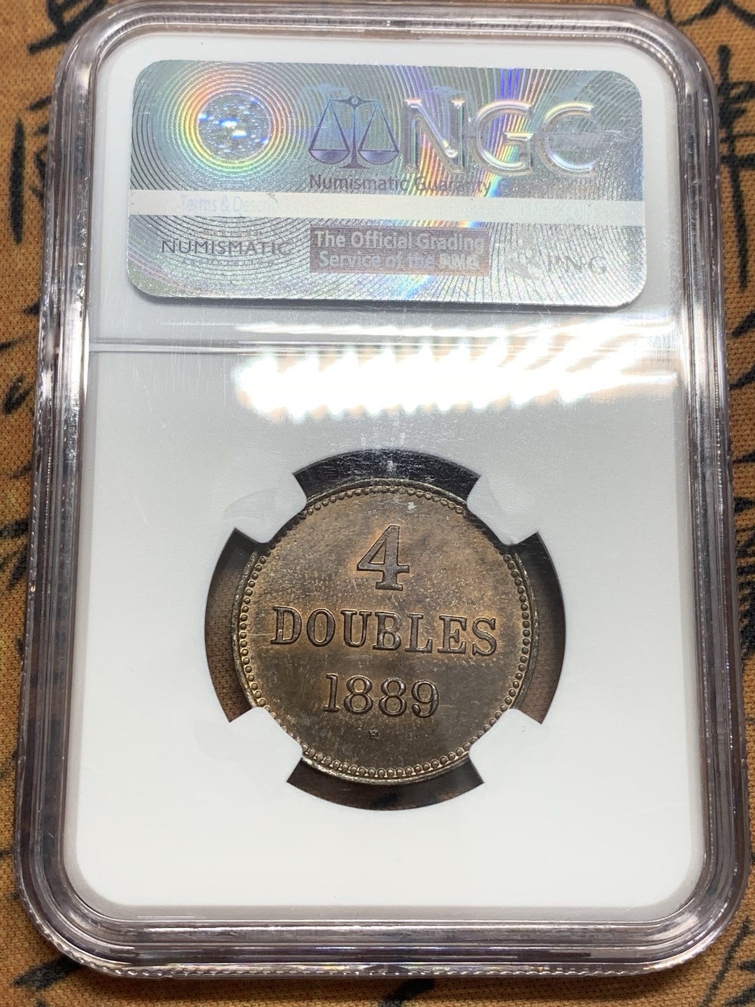 《竞宝斋》第83场-本周日，周一2场连拍（全场不限金额包邮） NGC-64RB 1889年 根西 4道布铜币