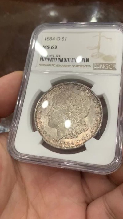 《竞宝斋》第83场-本周日，周一2场连拍（全场不限金额包邮） NGC MS63 1884年 美国摩根一元 五彩包浆
