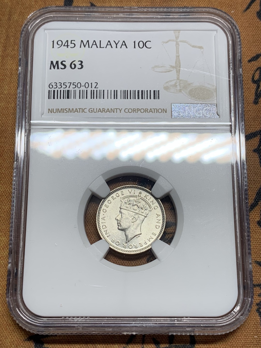 《竞宝斋》第84场-本周日，周一2场连拍（全场不限金额包邮） NGC-MS63 马来亚1945年10分银币。少见年份(常见是1941年)。