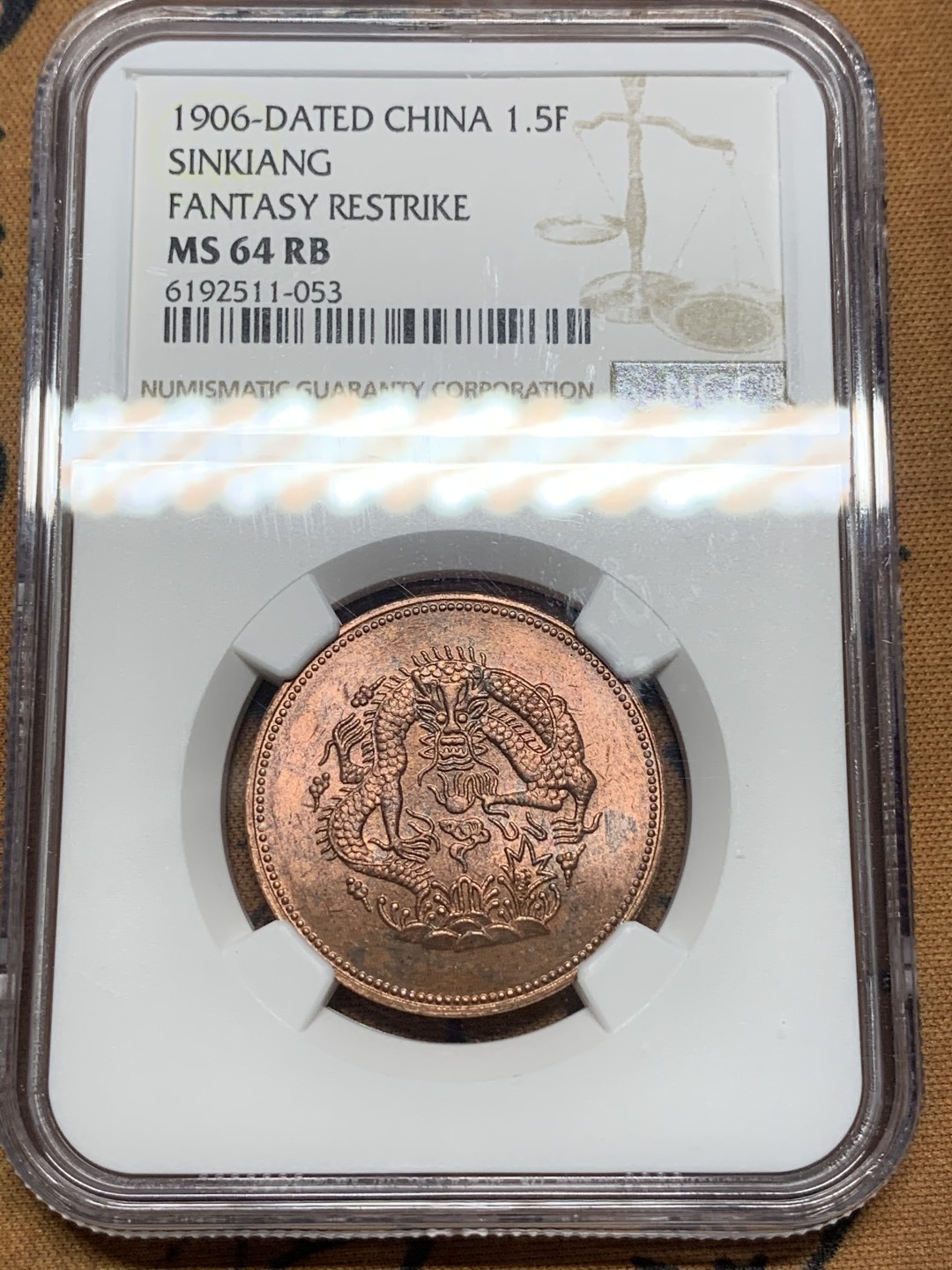 《竞宝斋》第84场-本周日，周一2场连拍（全场不限金额包邮） NGC-MS64 新疆1906年 后铸1.5分铜币 水龙