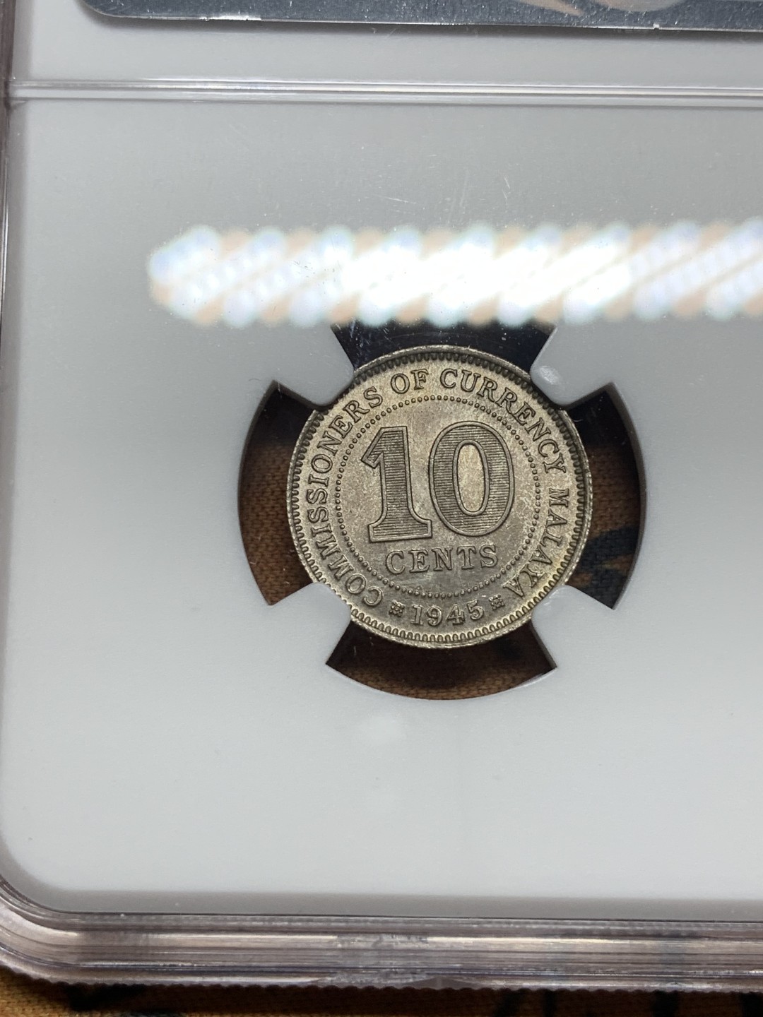 《竞宝斋》第84场-本周日，周一2场连拍（全场不限金额包邮） NGC-MS63 马来亚1945年10分银币。少见年份(常见是1941年)。