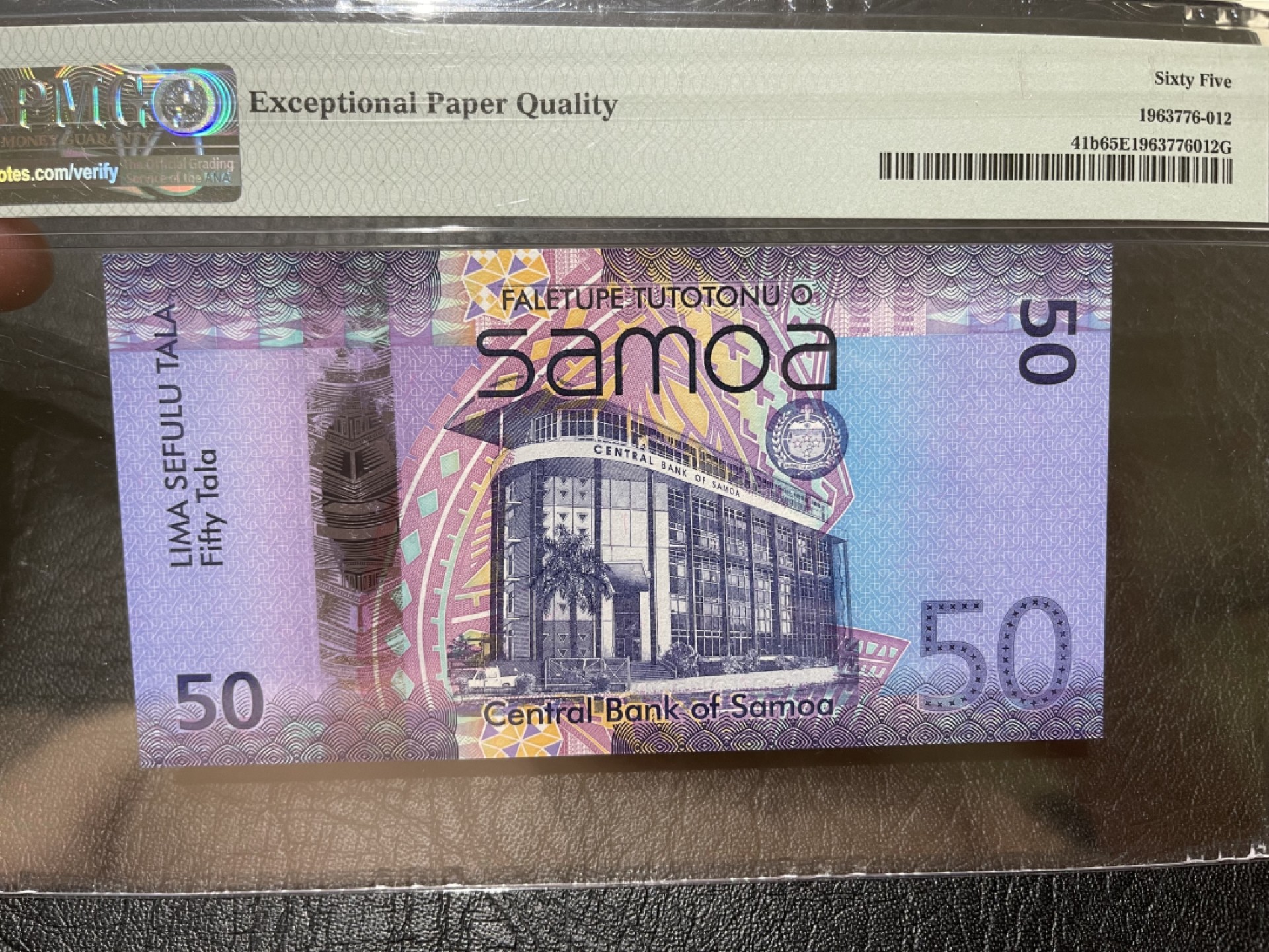《外钞收藏家》第一百九十五期 2014年萨摩亚50 PMG65 无47