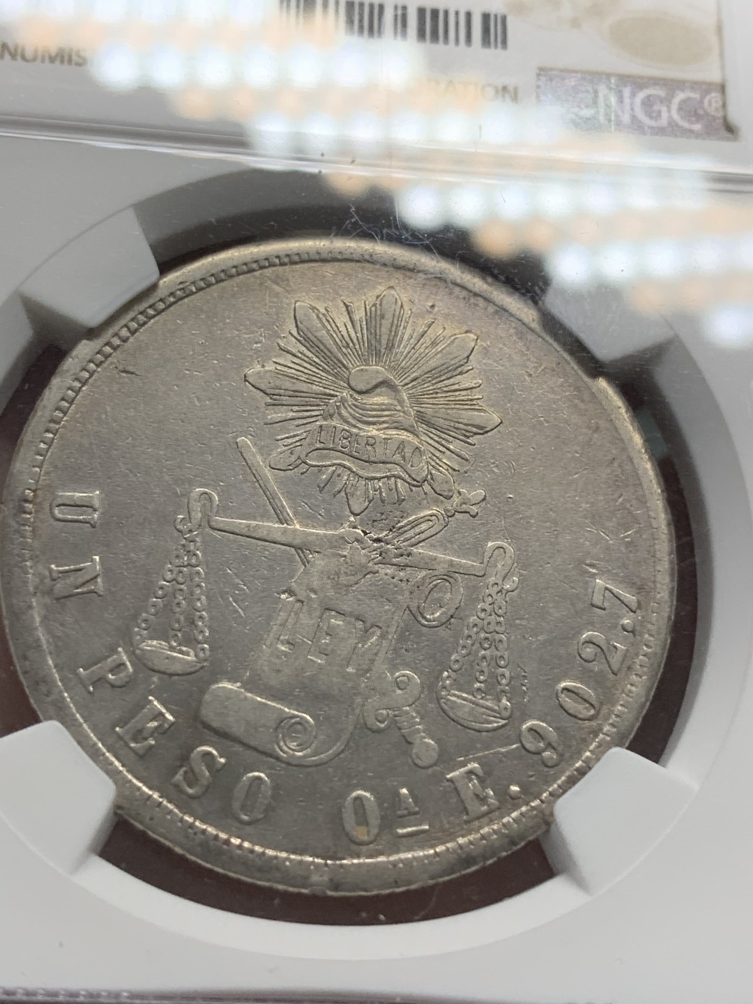 《竞宝斋》第85场-本周日，周一2场连拍（全场不限金额包邮） NGC-AUD  墨西哥 1870年OA E 天平鹰洋 1比索银币 小A版 