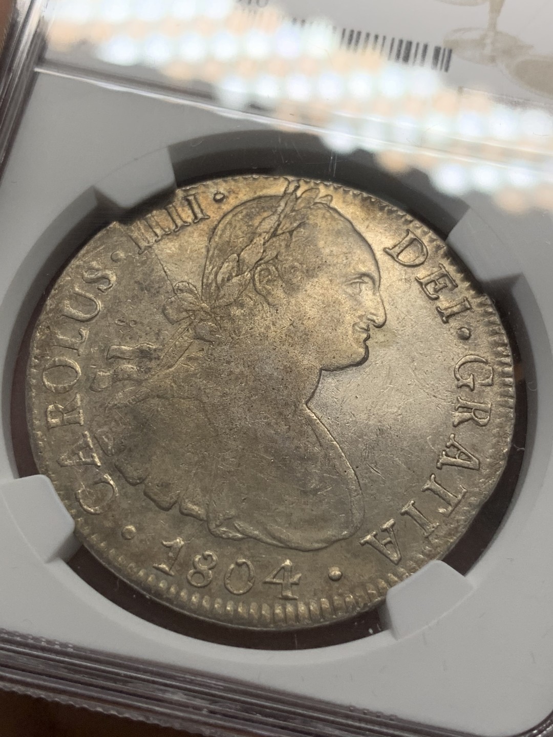 《竞宝斋》第85场-本周日，周一2场连拍（全场不限金额包邮） NGC AU 墨西哥 1804年 卡四 8R双柱大银币 深打细节 性价比不错